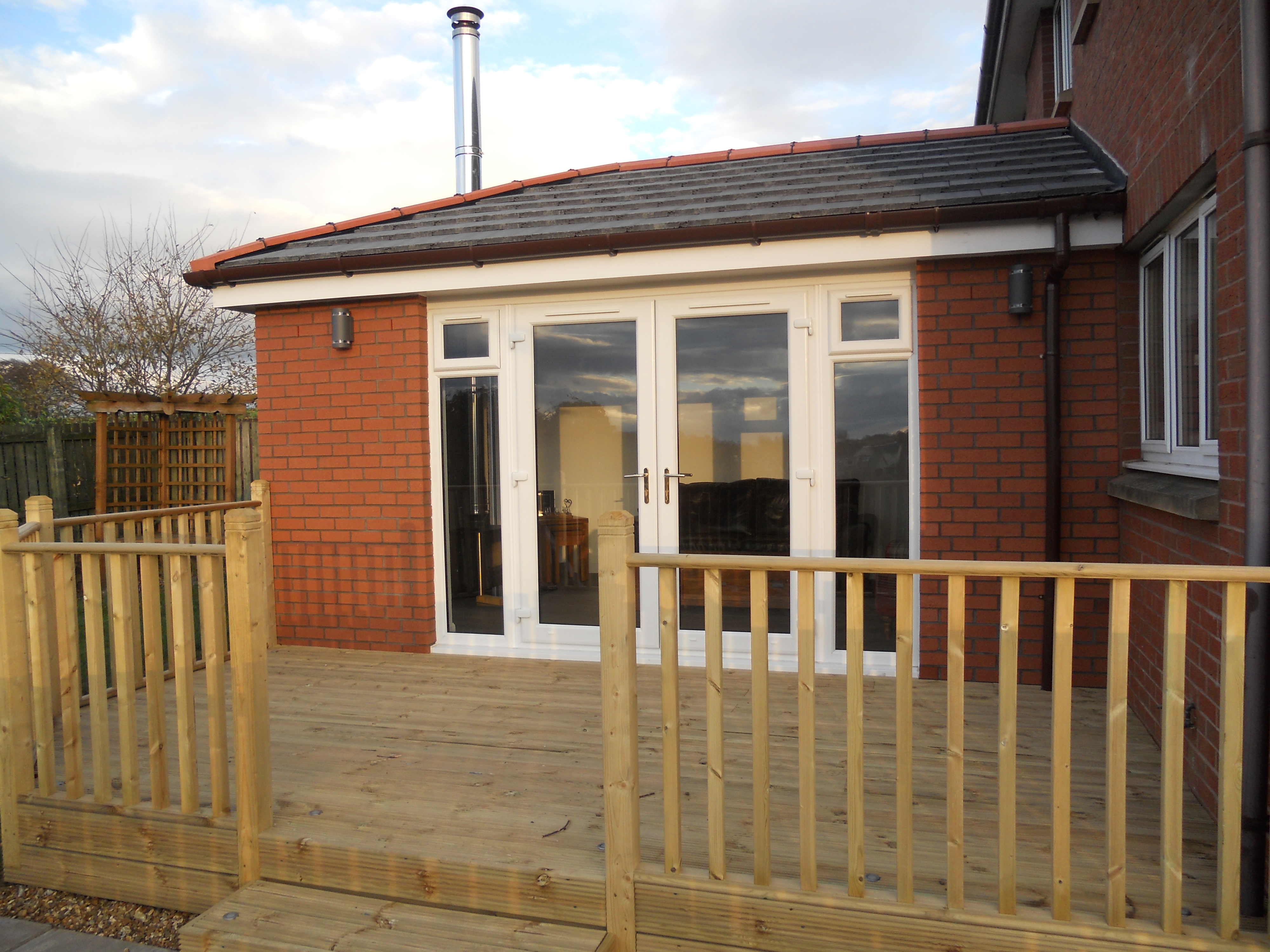 Single storey sunroom including log burner