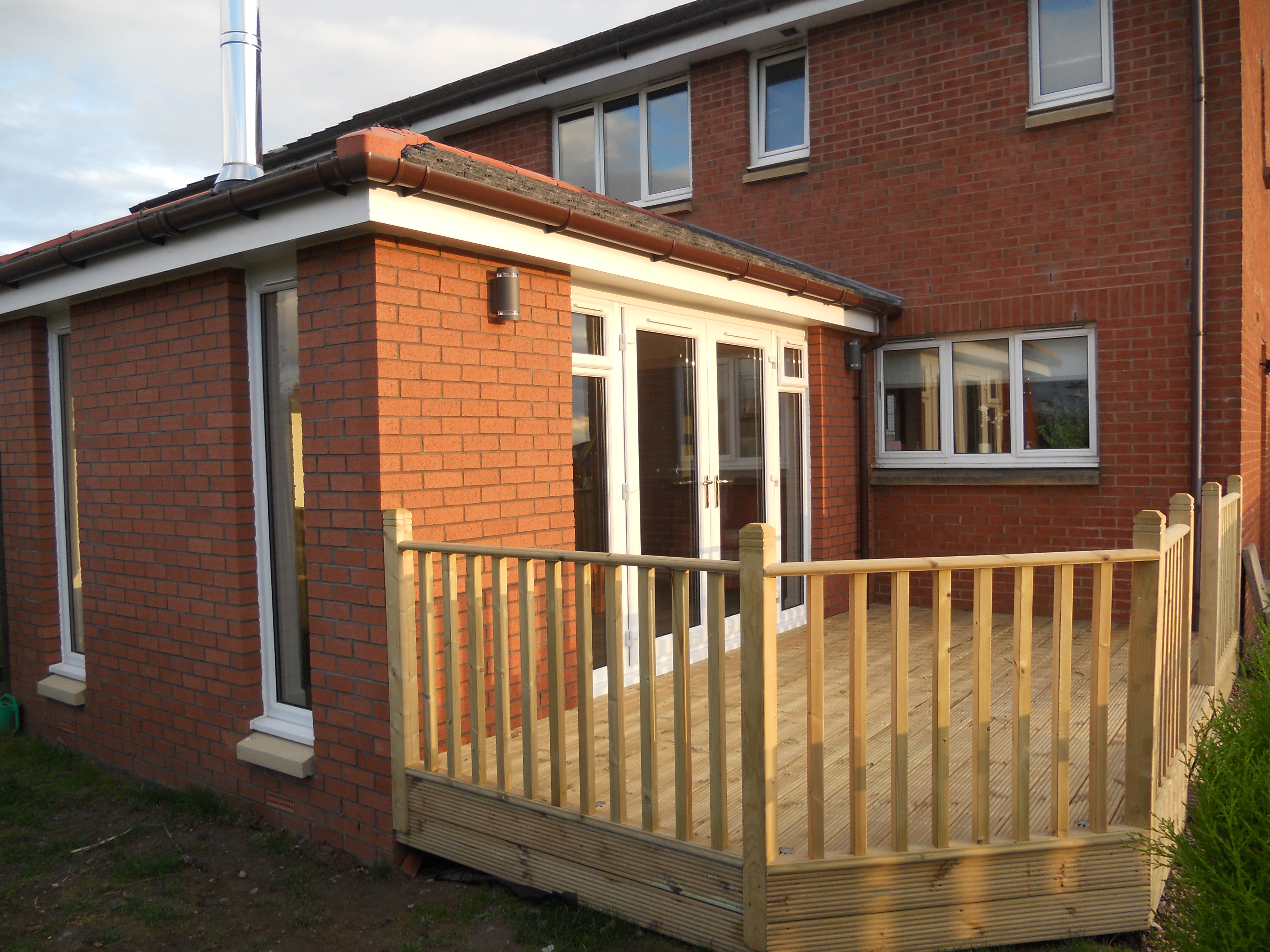 Single storey sunroom including log burner